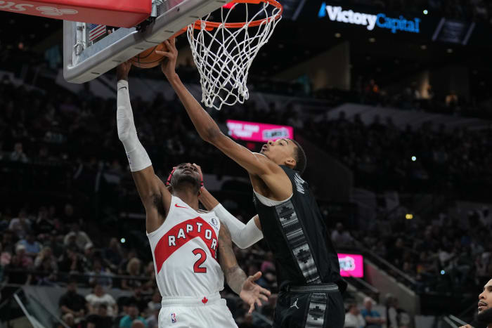 Nov 5, 2023; San Antonio, Texas, USA; San Antonio Spurs center Victor Wembanyama (1) blocks the shot by Toronto Raptors forward Jalen McDaniels (2) in the first half at the Frost Bank Center.